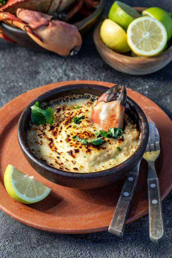 CHILEAN FOOD. Baked crabmeat crab meat with cheese, cream and bread. Traditional dish of chilean